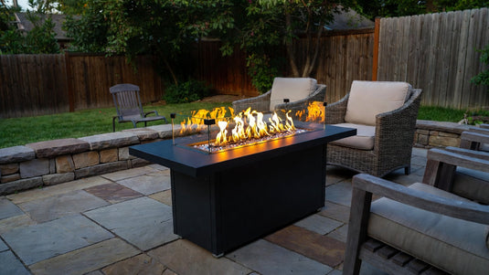 Install a propane fire table safely on backyard patio.