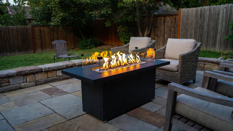 Install a propane fire table safely on backyard patio.